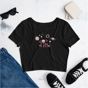 black crop tee with pink planetary graphics and I AM text